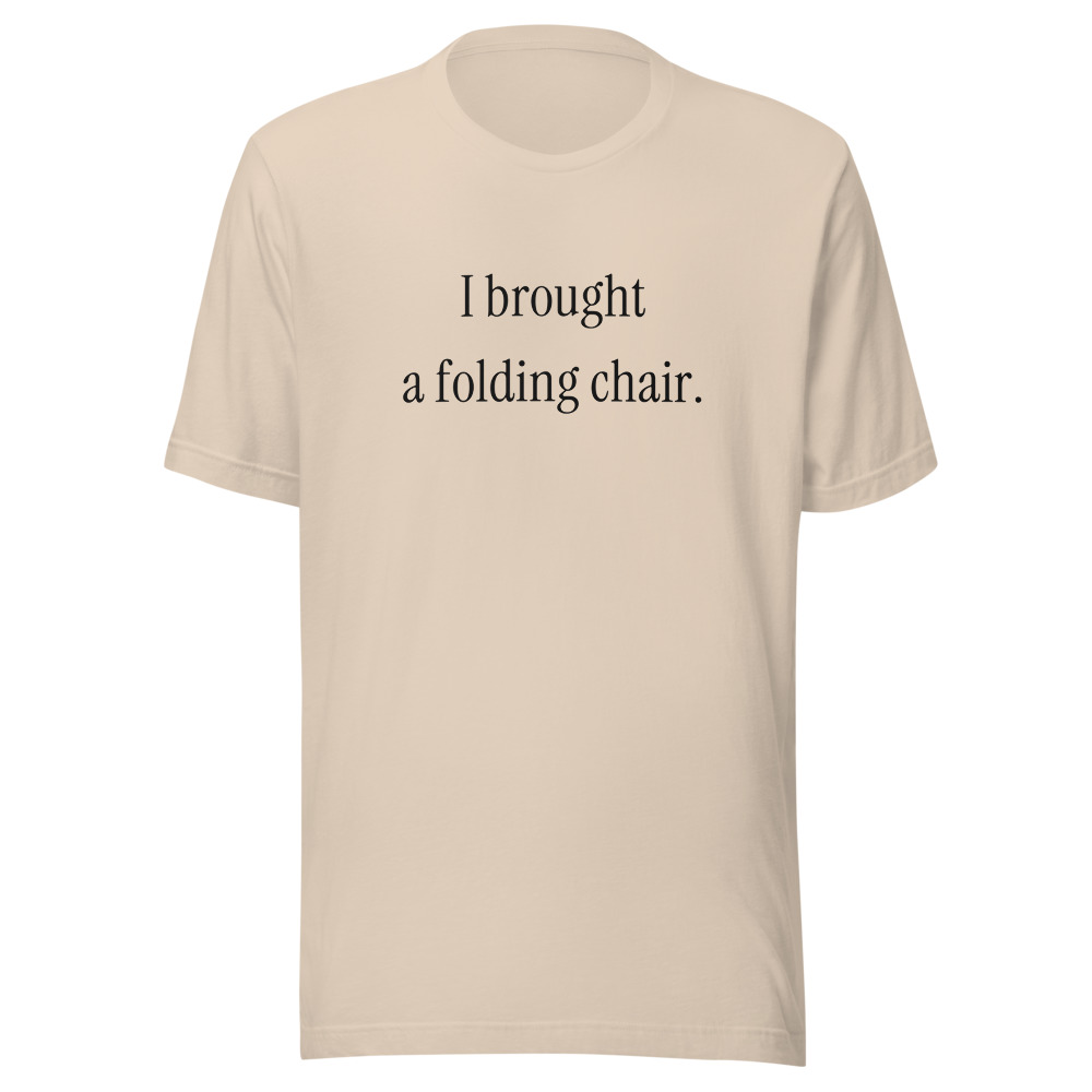 I brought a folding chair. on a soft cream shirt